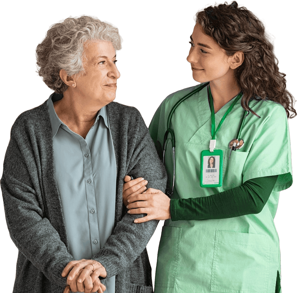 Pflegekraft von Ihr Team 24 stützt lächelnde Seniorin mit grauen Haaren – Symbol für Vertrauen und Fürsorge